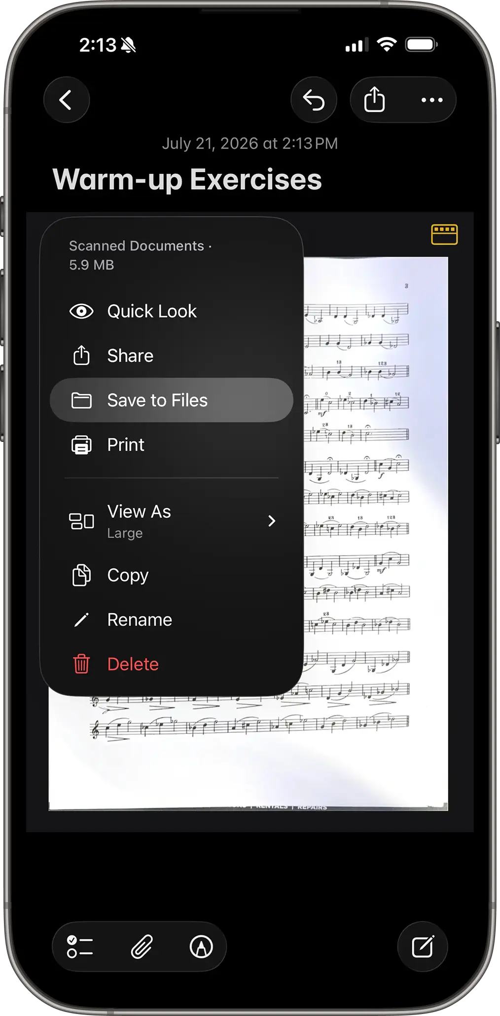 iPhone in the Notes app showing "Moved to Files" option when tapping on scanned document